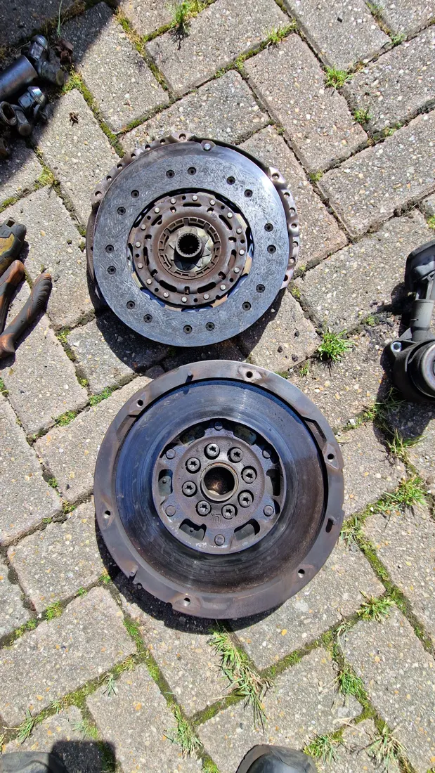 Worn clutch plate and flywheel